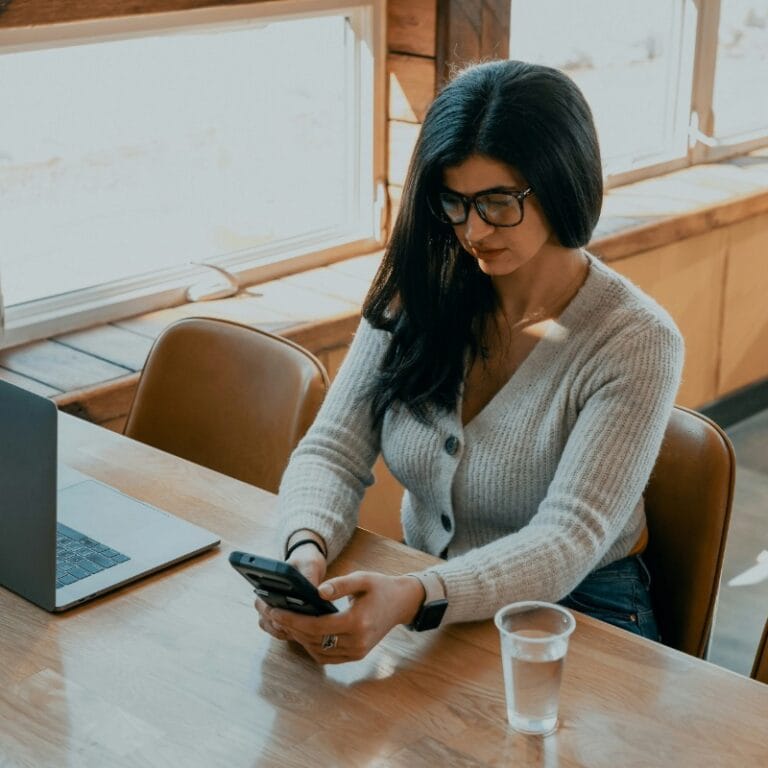 Professional woman managing business communications on a smartphone. Demonstrates the superiority of Checktxt over consumer apps like RoboKiller and Truecaller for enterprise use. Essential for US enterprises and MSSPs requiring business-focused accuracy with 99.9% precision and zero false positives. Checktxt delivers centralized management and professional threat intelligence with real-time analysis, moving beyond simple blocking. #Checktxt #EnterpriseSecurity #SMSProtection #NoFalsePositives #ThreatIntelligence #MSSP #BusinessSecurity #UnitedStates #RoboKillerAlternative #TruecallerAlternative